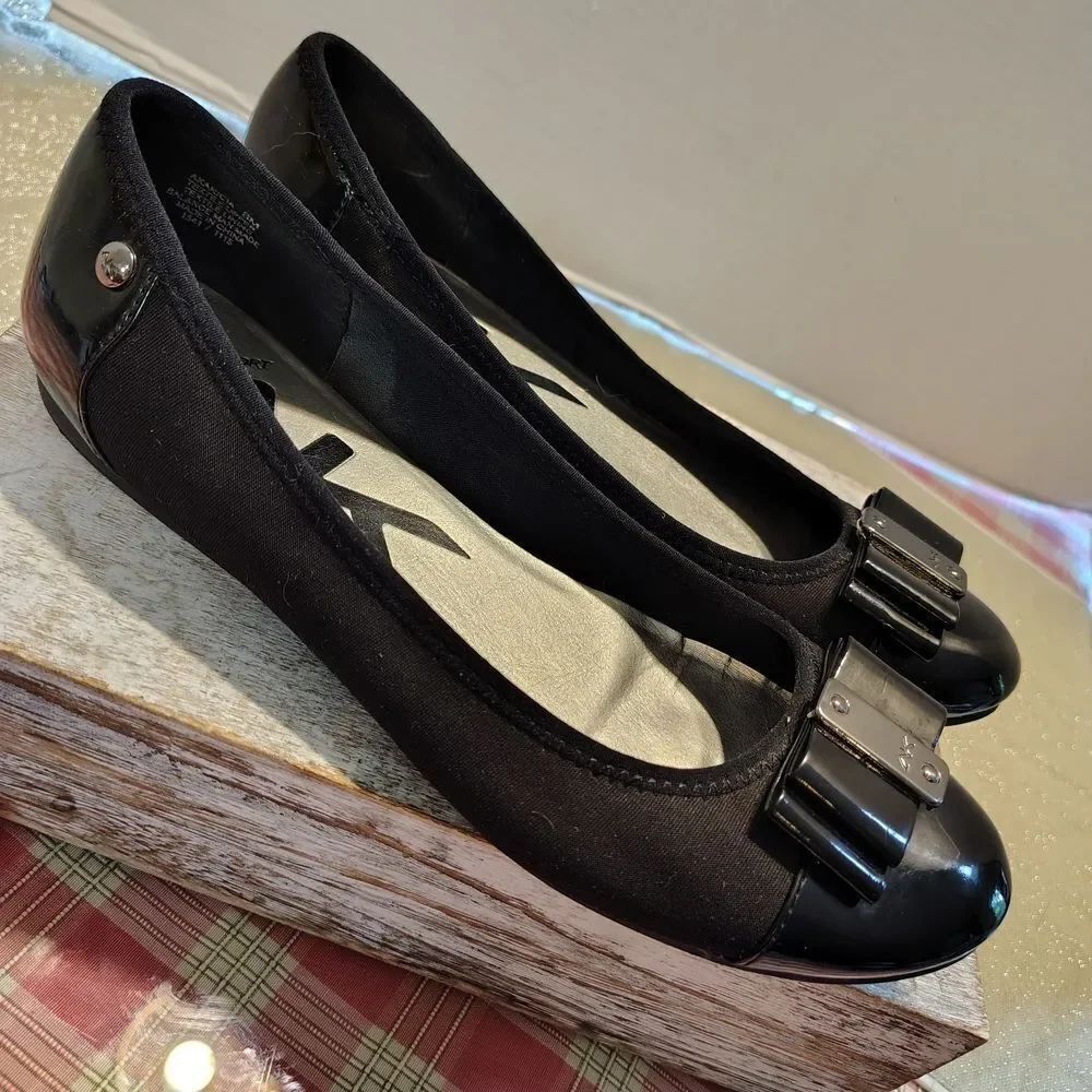 Anne Klein Black Flats with Metallic Accents. A14